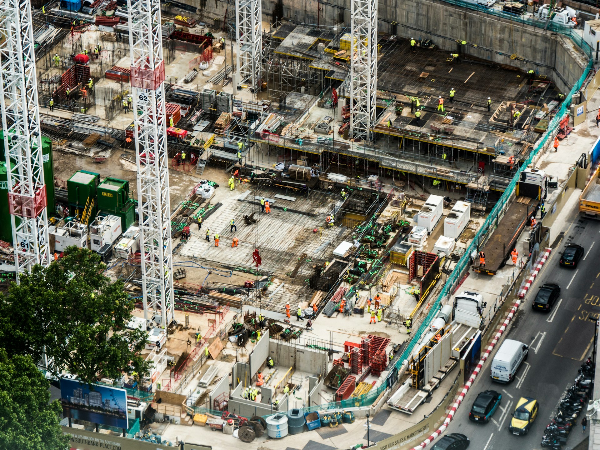 Aerial view of a busy city construction site monitored by Volpex AI CCTV